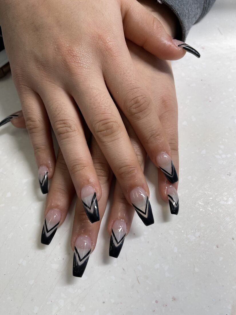 Long coffin set with black chevron French tips on a clear base