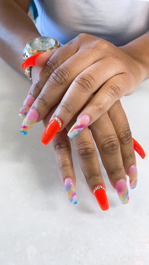 Neon orange coffin set with multi-colour confetti art on the accent nails