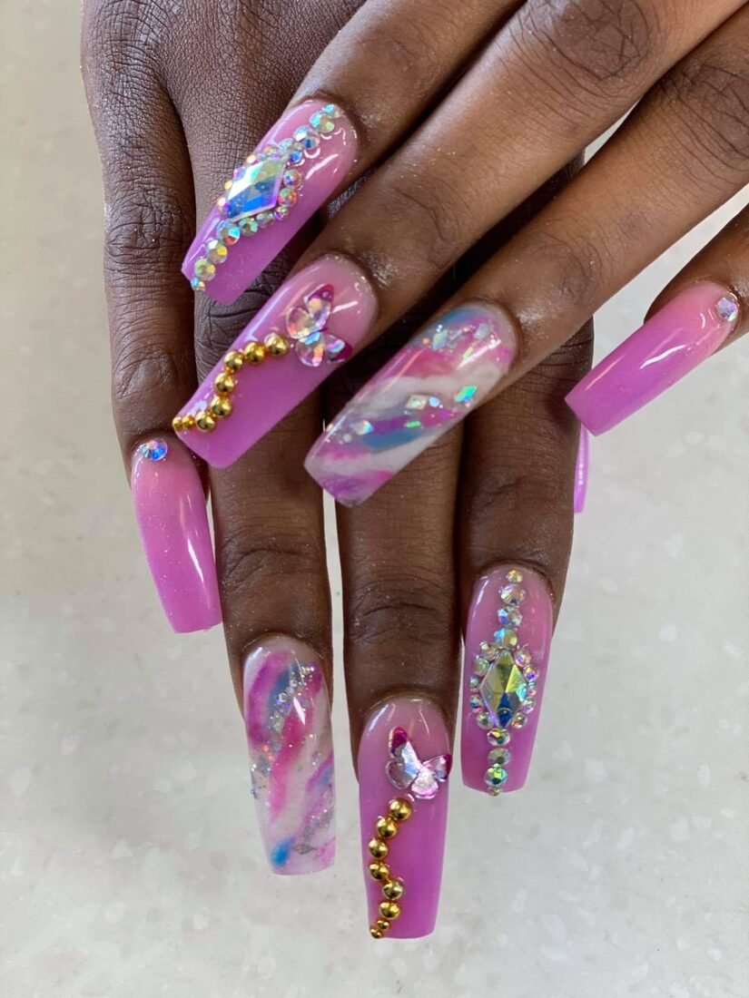 Long pink coffin set with marbled accents and crystal-encrusted nails