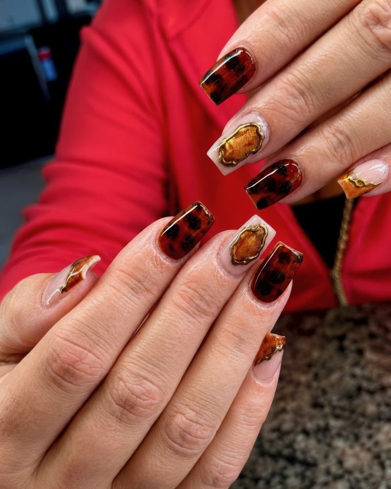 Deep brown set finished with gold chrome accents
